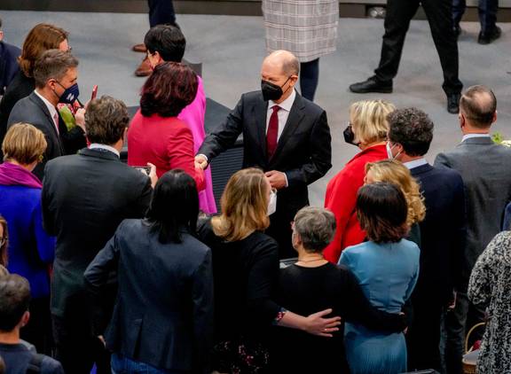 Olaf Scholz is congratulated after he was elected new German Chancellor in the German Parliament Bundestag in Berlin. Photo / AP