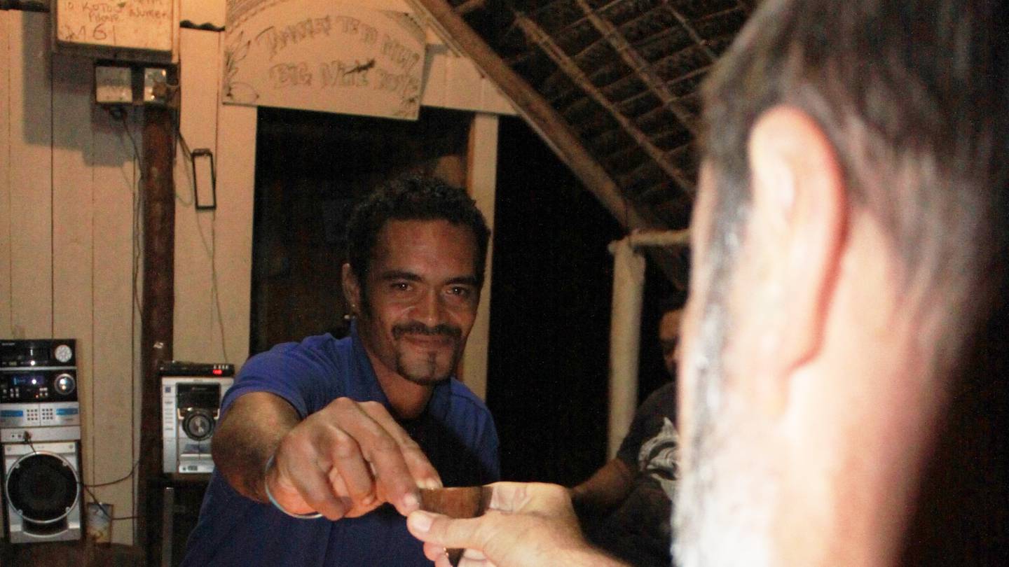 Drinking the special homebrew with the locals at a tumunu on Atiu island. Photo / Jim Eagles