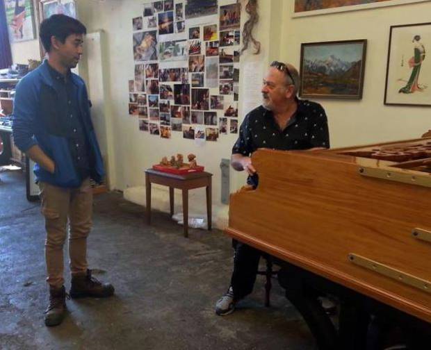 Adrian Mann (left) was shocked when Queen's keyboardist Spike Edney turned up to play his piano. Photo / Otago Daily Times.