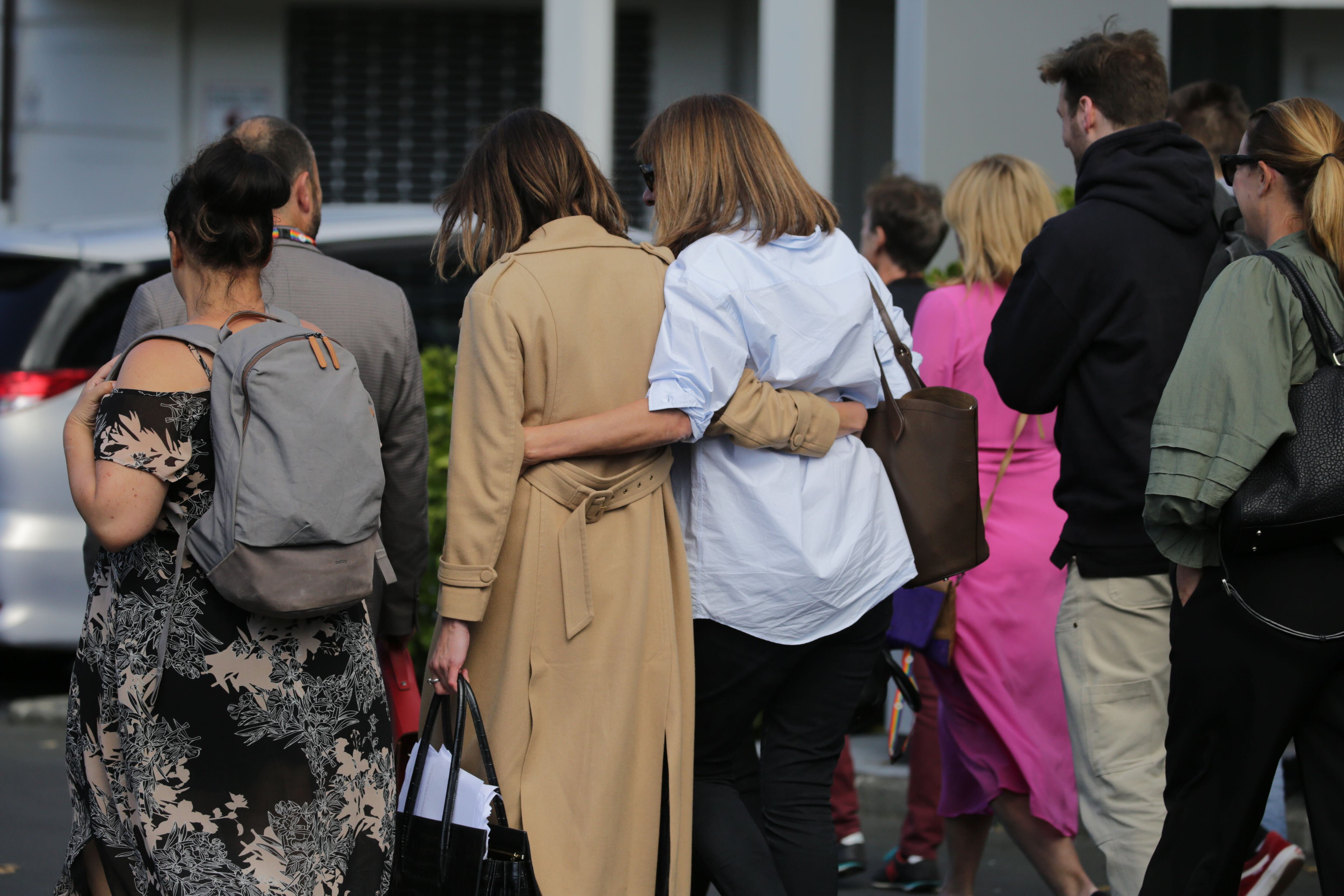 Today FM staff leave the MediaWorks building in Auckland after the station was taken off-air. Photo / Sylvie Whinray