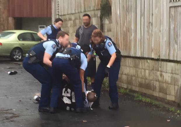 Police arrest a man in Beresford St, Central Auckland July 1. The man was Tasered several times and was taken to hospital where he passed away on July 4. Photo / NZ Herald 