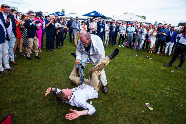Race-goers enjoy the atmosphere after the 2019 Melbourne Cup Day at Flemington Racecourse. Photo / Getty Images