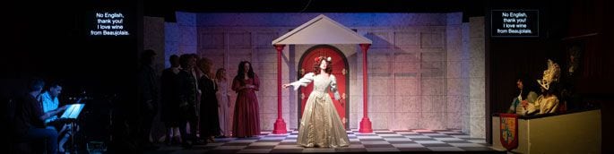 The trio of musicians to the left (with Matt Bodman in the spotlight) with lead actor Zoe Cruse as Nell Gwynn performing centre stage. Photo /  Pete Luxford Photography
