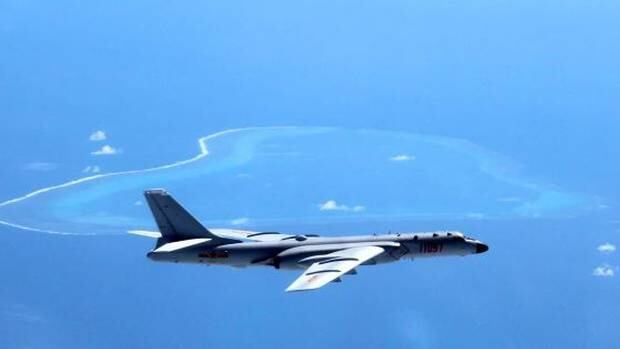 A Chinese H-6K bomber patrols the islands and reefs in the South China Sea. Photo / AP