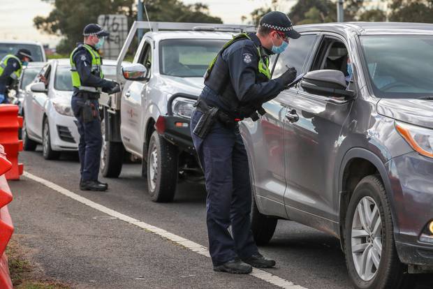 Police check permits and ID of drivers at a checkpoint in Little River for traffic coming from Melbourne into Geelong and the Bellarine Peninsula on Friday. Photo / Getty Images