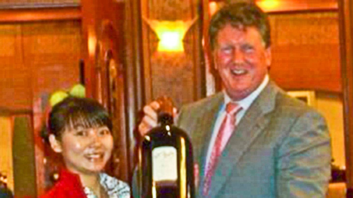 Donghua Liu's partner Juan Zhang and Rick Barker at a Labour fundraising auction in 2007.