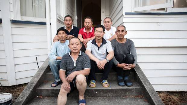 A group of Chinese workers who came to New Zealand after being promised work. Photo / RNZ