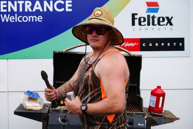 Taylor Steedman was manning the barbecue at the Wilson St Ridgway St corner. Photo/ Lewis Gardner 