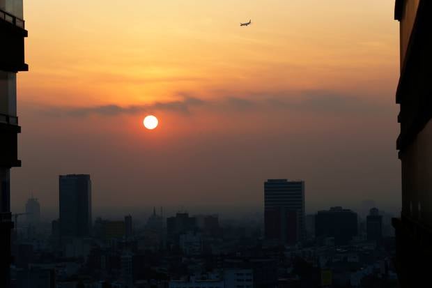 Smog shrouds the Mexican capital in Mexico City. Students across the world skipped class this month to protest inaction on climate change and rising air pollution levels. Photo / AP Photo/Marco Ugarte