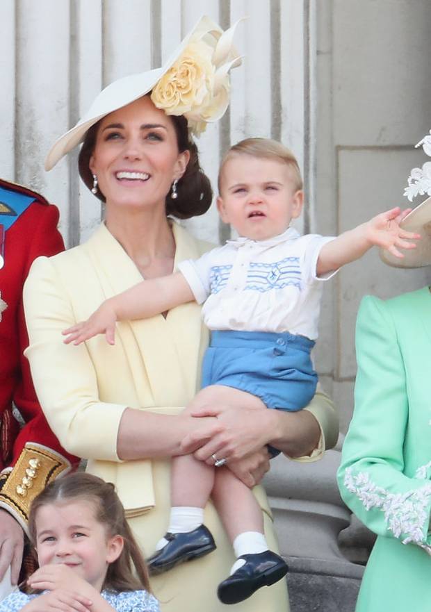 Catherine, Duchess of Cambridge holds Prince Louis while he waves at the crowds. Photo / Getty Images