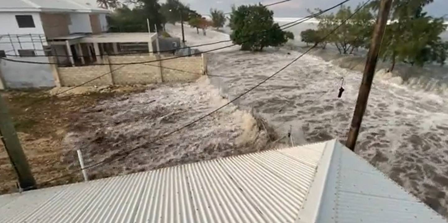 Waves flood the streets of Tonga. Photo / via Twitter