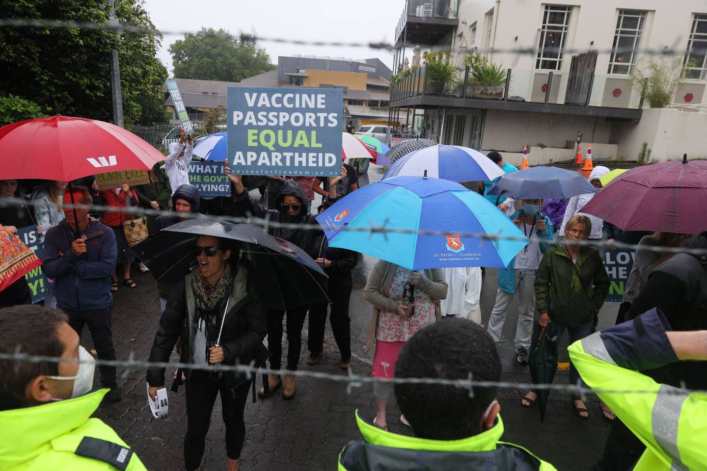 Protesters start chanting outside a sod turning event for the Waikato Regional Theatre in Hamilton CBD today that Prime Minister Jacinda Ardern is attending. Photo / Mike Scott