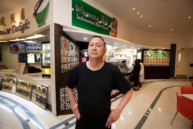 Freddy Iskandar, of Waroeing Bali in Atrium Food Court, says his business sales are well down, and wonders how much longer he can go on. Photo / Brett Phibbs