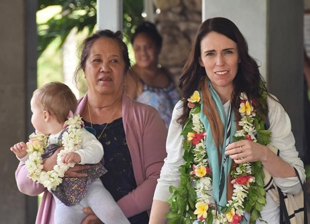 Jacinda Ardern at Rarotonga International Airport with Akaiti Puna, the wife of prime minister Henry Puna, and baby Neve. Photo / Cook Islands News