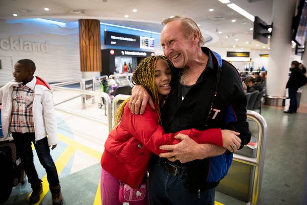 Mike Carruthers is reunited with his stepdaughter Saadia Moktari, 10. The family have been apart for 18 months. Photo / Dean Purcell 