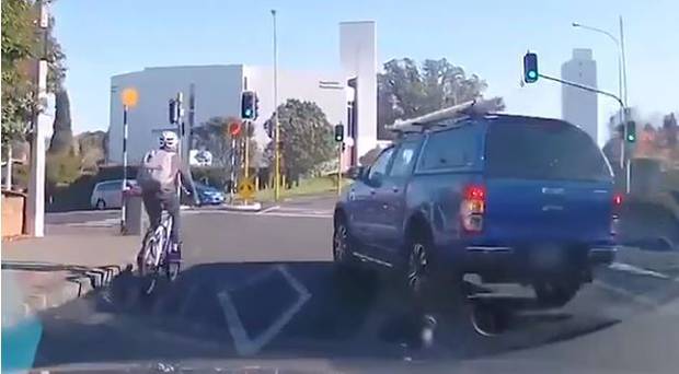 A ute has been caught on camera nearly wiping out a cyclist on Remuera Road on Friday. Photo / Supplied