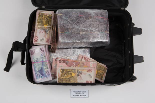 Some of the cash recovered by authorities during raids on Yim's properties and cars. Photo / Supplied