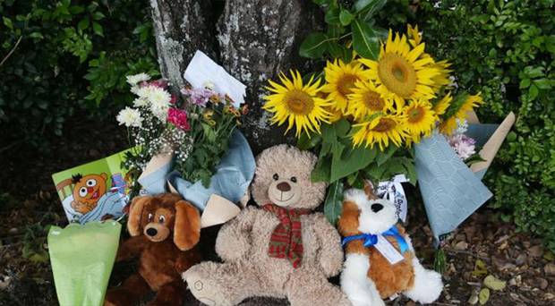Members of the public left flowers and teddies at the Goodstart Early Learning Centre. Photo / News Corp Australia 