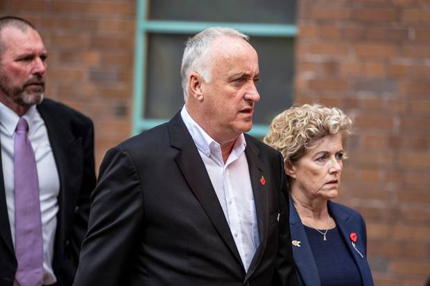 Grace Millane's parents David Millane and Gillian Millane arrive at Auckland High Court on Wednesday, accompanied by Detective Inspector Scott Beard. Photo / Michael Craig