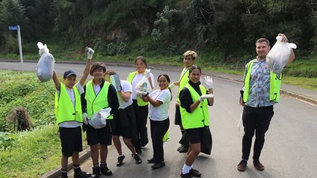 Teacher Richard Higgins and students from Room 9R make their way up Commercial St in Kawakawa. Photo / Peter de Graaf 