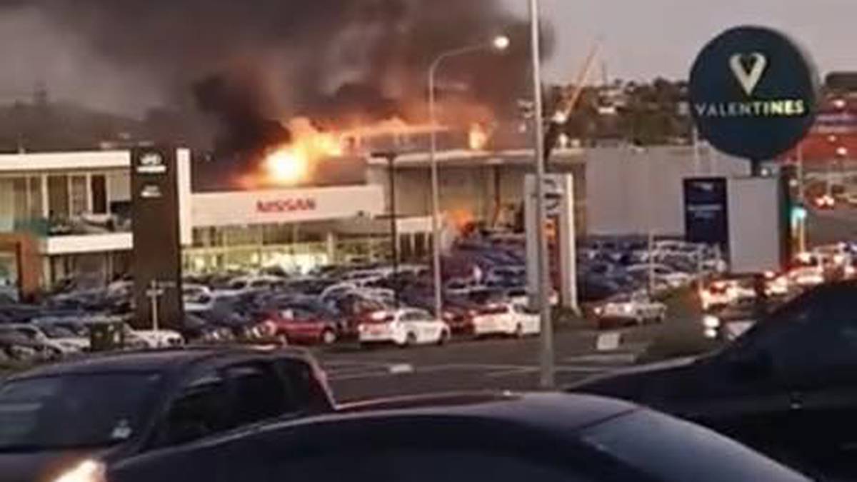 Plumes of smoke coming from a commercial building on Auckland's North Shore  - NZ Herald