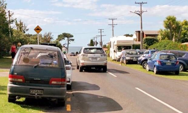 The verges of Pa Rd, Hahei packed soild with holidaymakers' vehicles in summer. Photo / Supplied