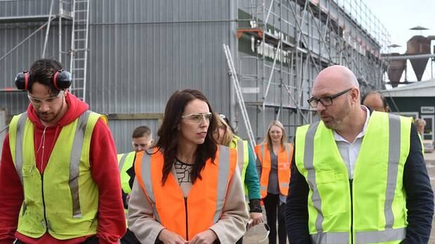 Mana in Mahi participant Tipene Van Den Anker walks around Tunnicliffes Timber with Prime Minister Jacinda Ardern and Tunnicliffes co-owner Scott McCabe. Photo / Katee Shanks