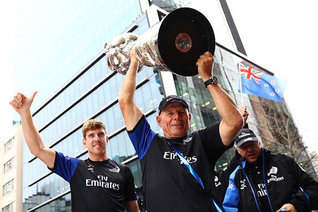 Peter Burling and Grant Dalton celebrate with the Americas Cup. Photo / Getty