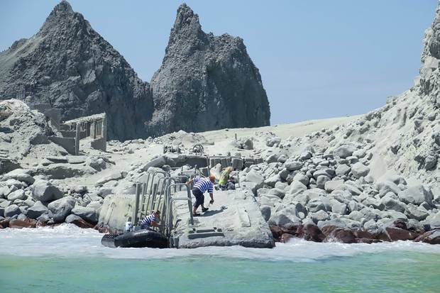 Tourists are cleared from White Island following yesterday. Photo / Michael Schade