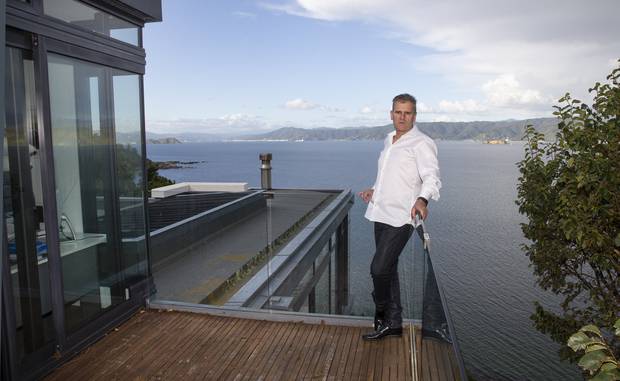 Matthew Ryan on the deck of his house in Karaka Bay, Wellington, which he rented to a foreign diplomat. Photo / Mark Mitchell