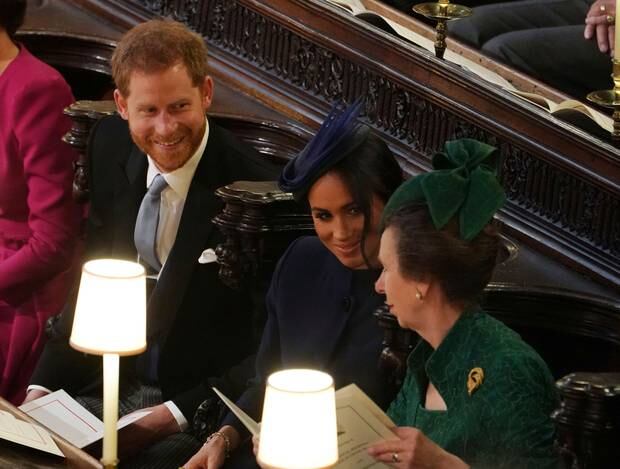 Prince Harry and Meghan, Duchess of Sussex, talk with Princess Anne, at the wedding of Princess Eugenie of York and Jack Brooksbank on Friday. Photo / AP