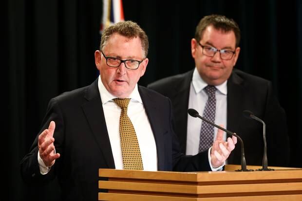Reserve Bank Governor Adrian Orr speaks while Finance Minister Grant Robertson looks on during a press conference at Parliament. Photo / Mark Mitchell