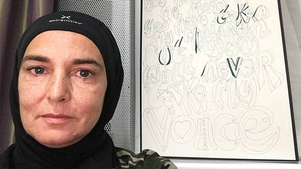 Sinead O'Connor (pictured) has sparked outrage on Twitter by claiming she no longer wants to spend time with 'disgusting white people' after converting to Islam. Photo / Twitter 