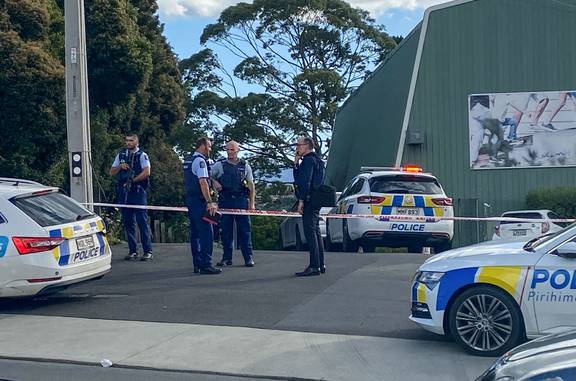 Police on the scene outside the Waitakere Badminton Centre on Royal Road in Auckland's Massey. Photo / Lincoln Tan
