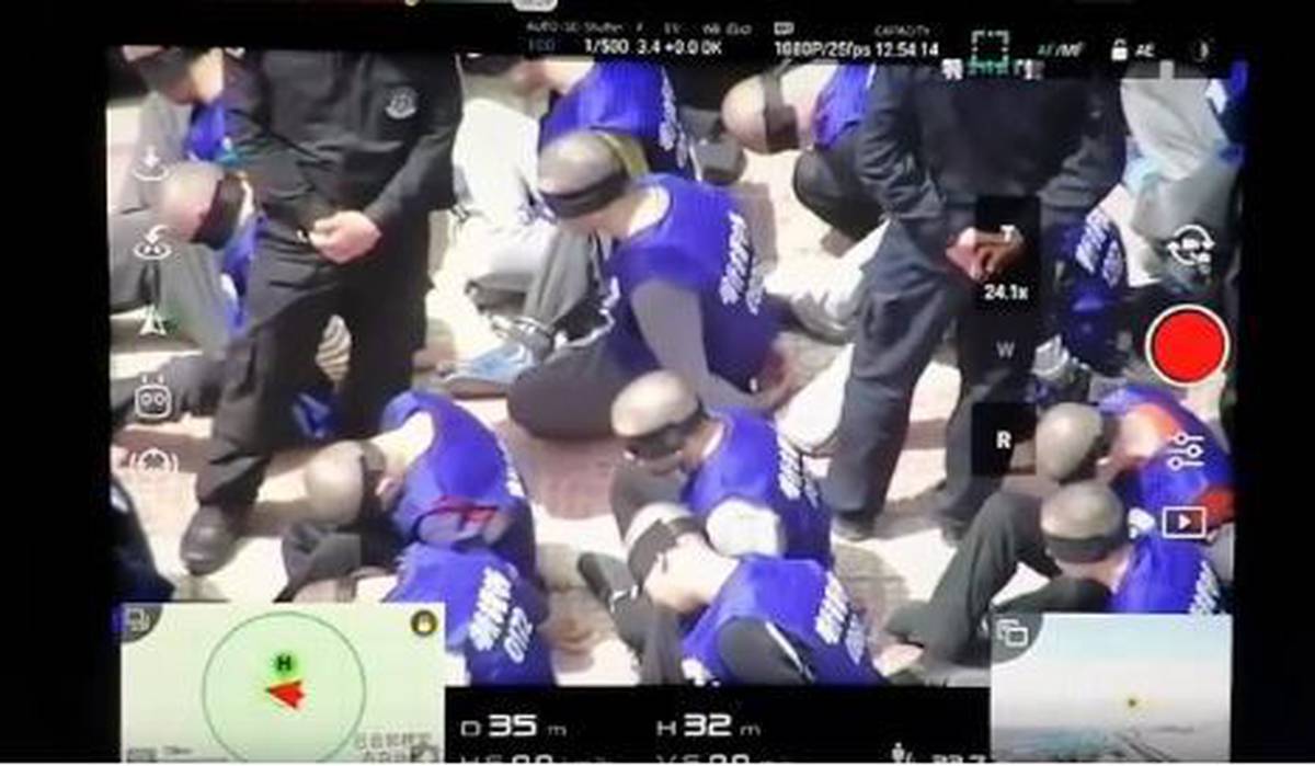 Chilling video shows Chinese police transferring hundreds of prisoners