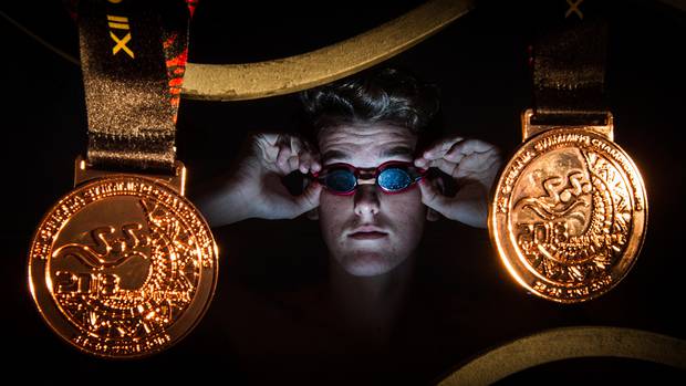 Swimmer David Boles with his two bronze medals from Oceania Champs. Photo / Stephen Parker