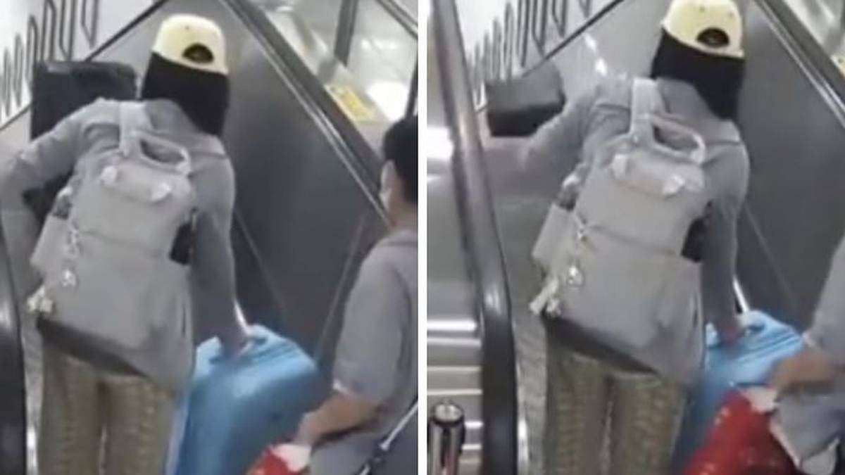 Frau von fallendem Koffer auf Rolltreppe in China getroffen