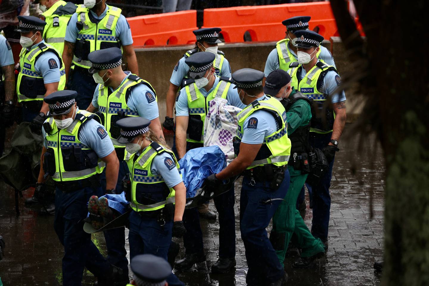 A person has been carried away from the protest on a stretcher. Photo / George Heard