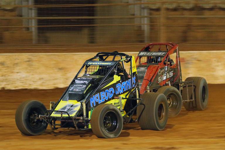 Luke McClymont (5) battles with Boyd Westbury on his way to victory in the King of the Bay title for Six Shooters at Baypark Speedway.