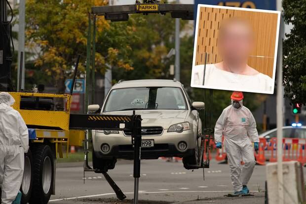 Accused mosque gunman Brenton Tarrant's car, with bullet holes in the windscreen, is removed from the scene of his Brougham St address. Photo / Claire Chambers