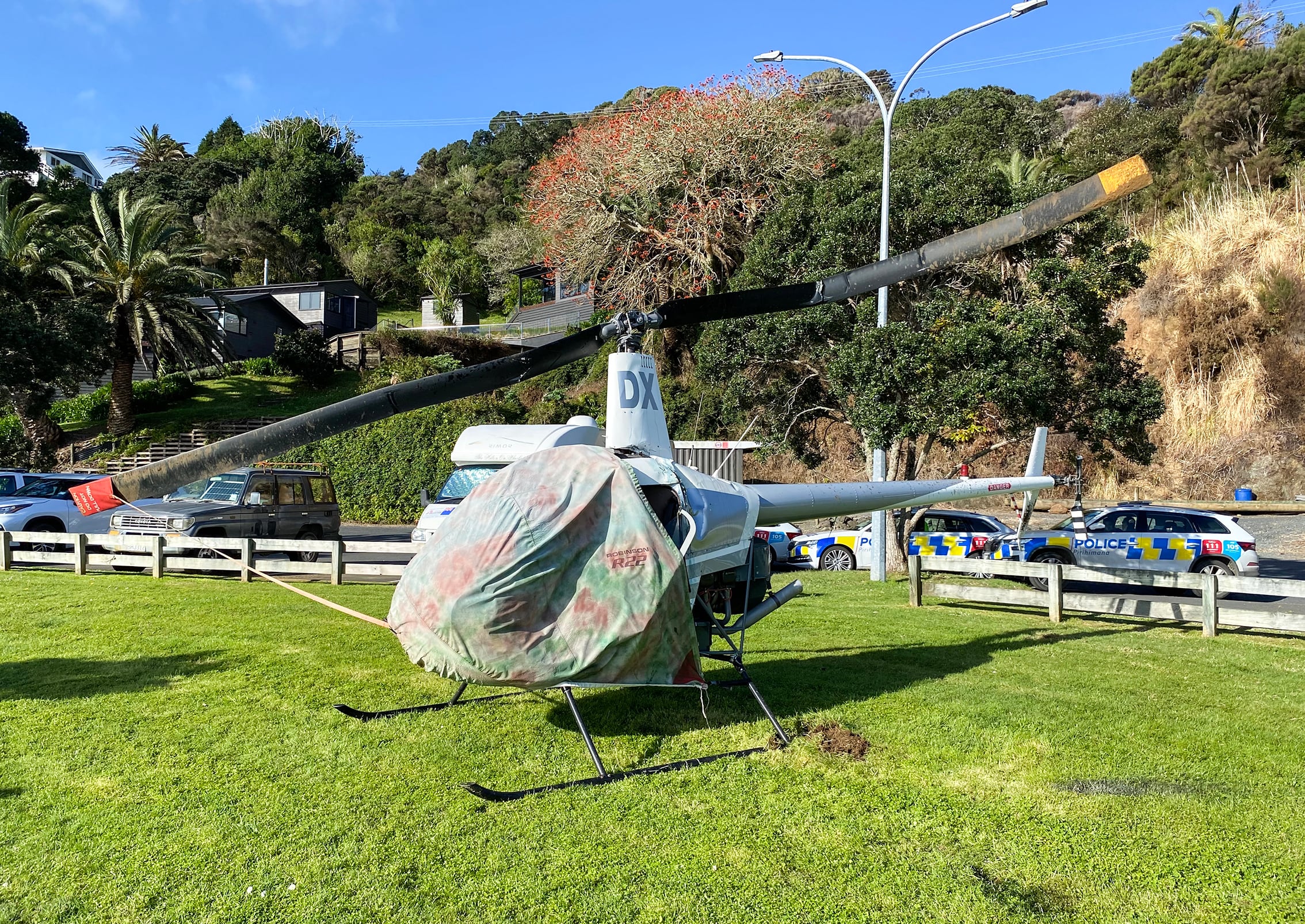 The rotor blades on a helicopter were bent out of shape after it rolled on its side during take-off today at Whangaroa. Photo / David Fisher