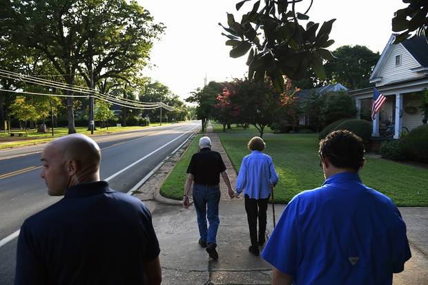 After dinner at their friend's house, Jimmy and Rosalyn Carters walk home with two Secret Service close behind. Photo / Washington Post