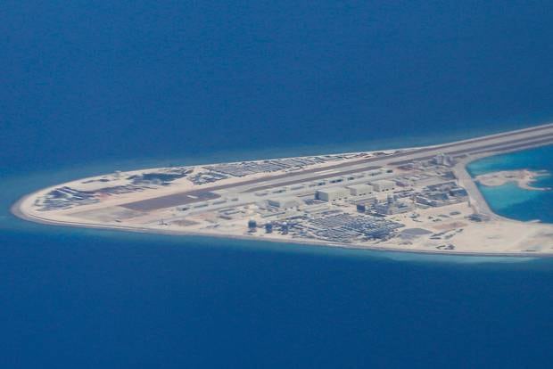 In this April 21, 2017, file photo, an airstrip, structures and buildings on China's man-made Subi Reef in the Spratly chain of islands in the South China Sea are seen. Photo / AP 