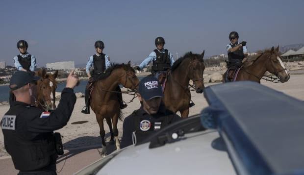 French police patrol a beach in Marseille, southern France.