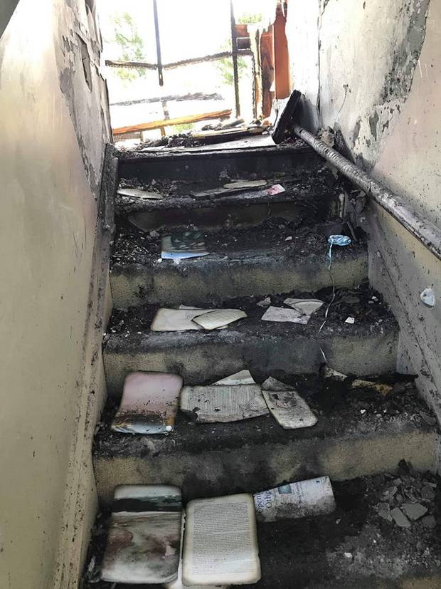 Charred remains: The Smith family home in Paremoremo. Photo / Supplied 