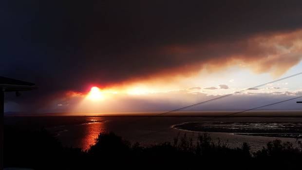 The smoke begins to envelop the area, looking from Marybank, Nelson. Photo / Julie Burt