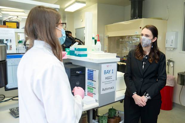 Prime Minister Jacinda Ardern speaks to a lab technician during a visit to the Malaghan Institute of Medical Research at Victoria University. Photo / Getty Images