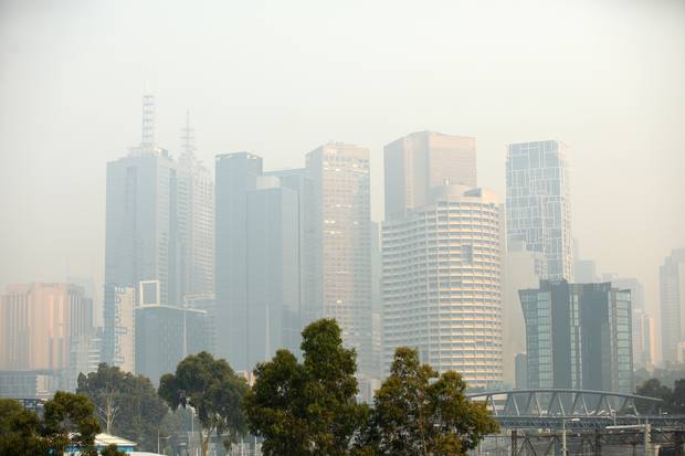 A general view of the city shrouded in smoke at Melbourne Park. Photo / Getty Images