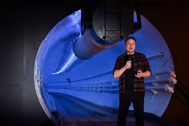 Elon Musk speaks during the unveiling of the Boring Company's Hawthorne test tunnel. Photo / AP