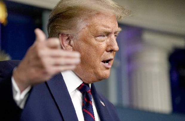 Just four months ago, when Covid-19 put more than 20 million Americans out of work, the thought of Donald Trump fighting November's election on the economy seemed farcical. Photo / AP